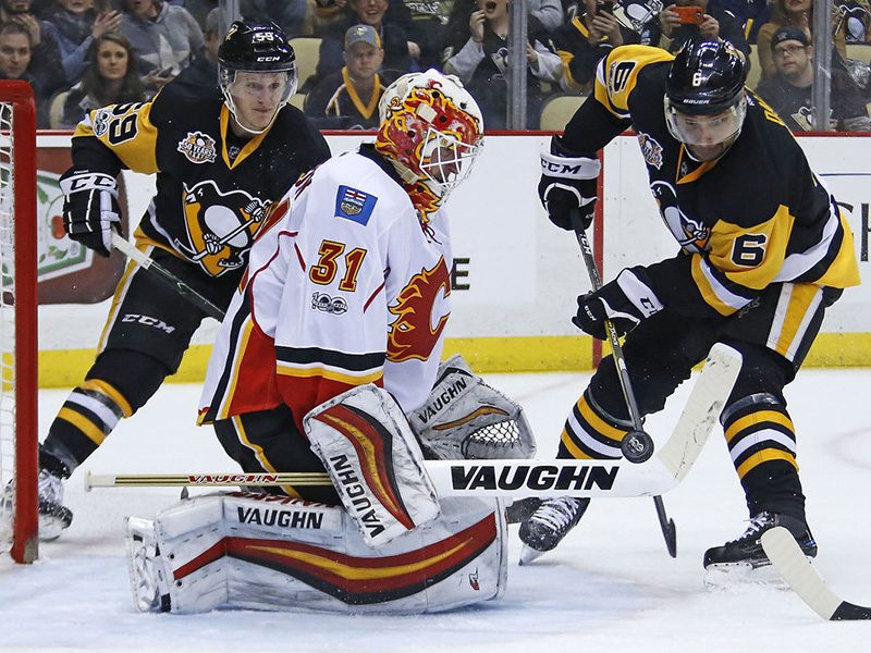 Flames snap Penguins’ three-game win streak in shootout